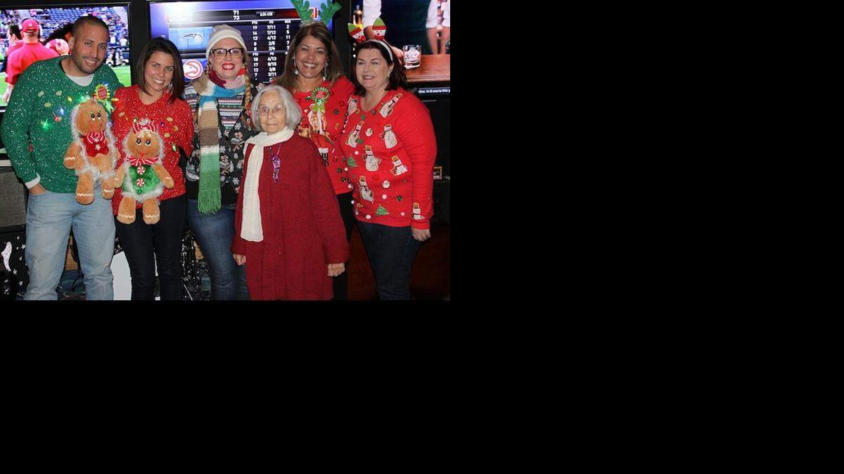
LOVE THOSE SWEATERS: This group of folks couldn't wait to get to Woody's West End Tavern on Dec. 12 to "show off" their ugly sweaters and help raise money for Relay for Life at the same time.
