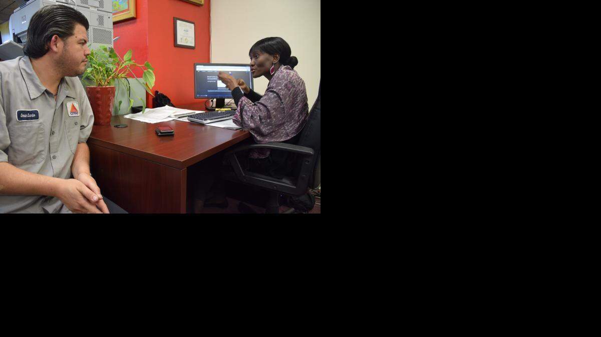 
Omar Luna, a 38-year-old mechanic from Miami, signs up for health coverage for the first time under the Affordable Care Act with Epilepsy Foundation of Florida healthcare counselor Nathalie Mathias at the Sant La Haitian Neighborhood Center Thursday. Enrollment has spiked in the last few weeks as consumers rush to sign up before open enrollment ends on Feb. 15. 
