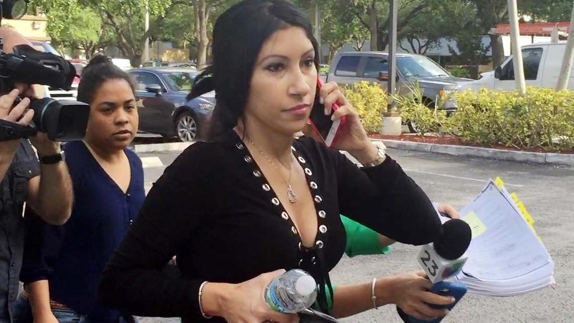 Notary public Carmen Aslan, who works for the FM Law Group, refuses to respond to questions from the media.