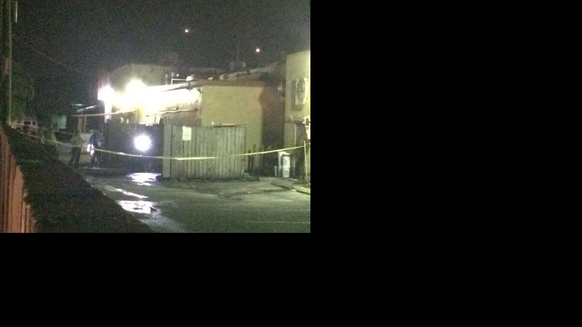 
The scene at a strip mall in Sweetwater is shown Saturday night, Oct. 11, 2014, where a body was found ablaze.
