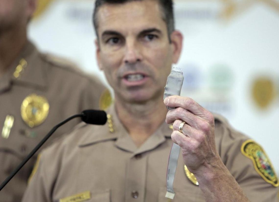 Juan Perez, director of Miami-Dade Police, holds up a device that is commonly used to steal credit card information at gas stations. Miami-Dade County is the only county in Florida without an elected sheriff; it appoints a police director at the discretion of the mayor.