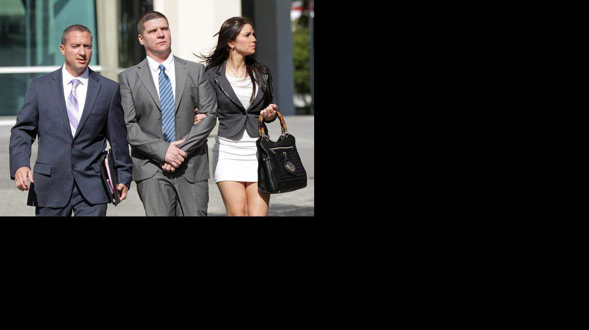 
Gilberto Suarez, center, at the federal courthouse in Miami on Tuesday, Dec. 16, 2014, with his attorney, left, and his partner. Suarez pleaded guilty to human trafficking of Cuban baseball player Yusiel Puig.
