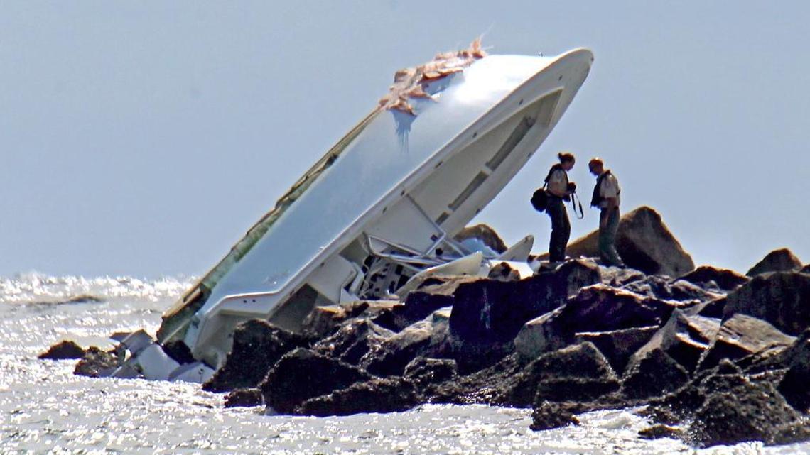 Investigators examine the boat that Marlins pitcher Jose Fernandez and two others were aboard when it crashed into the jetty on South Beach on Sunday, Sept. 25, 2016.
