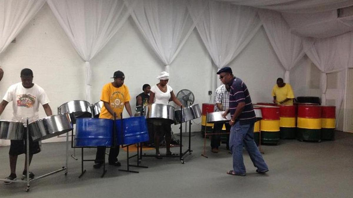 
Henry Potter directing Tamboo Bamboo as they rehearse for the annual "Panorama" steel band competition before the Miami Broward Carnival.
