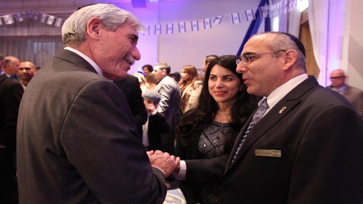 Jacob Solomon, left, is greeted by Consulate General Chaim Shacham, right, and his wife, Mishala. The Consulate General of Israel to Florida and Puerto Rico hosted a celebration in honor of Israel’s 67th Independence Day anniversary at Aventura Turnberry Jewish Center on Thursday. For more, go to MiamiHerald.com