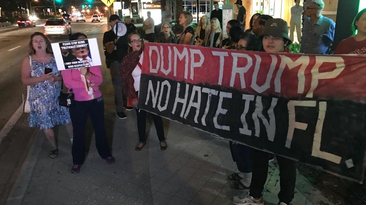 About 20 demonstrators were protesting President-Elect Donald Trump in Sunny Isles Beach on Friday night.