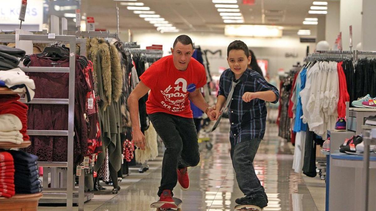 Jonovan "Angel" Verrier, 6, rides a skateboard with skateboard instructor, Paul Hurtado as part of his Make-A-Wish at the Macy's store in Aventura Friday, Dec. 11, 2015. Macy’s and Make-A-Wish celebrated the seventh annual National Believe Day, which helps Make-A-Wish grant wishes to children with life-threatening medical conditions across America.