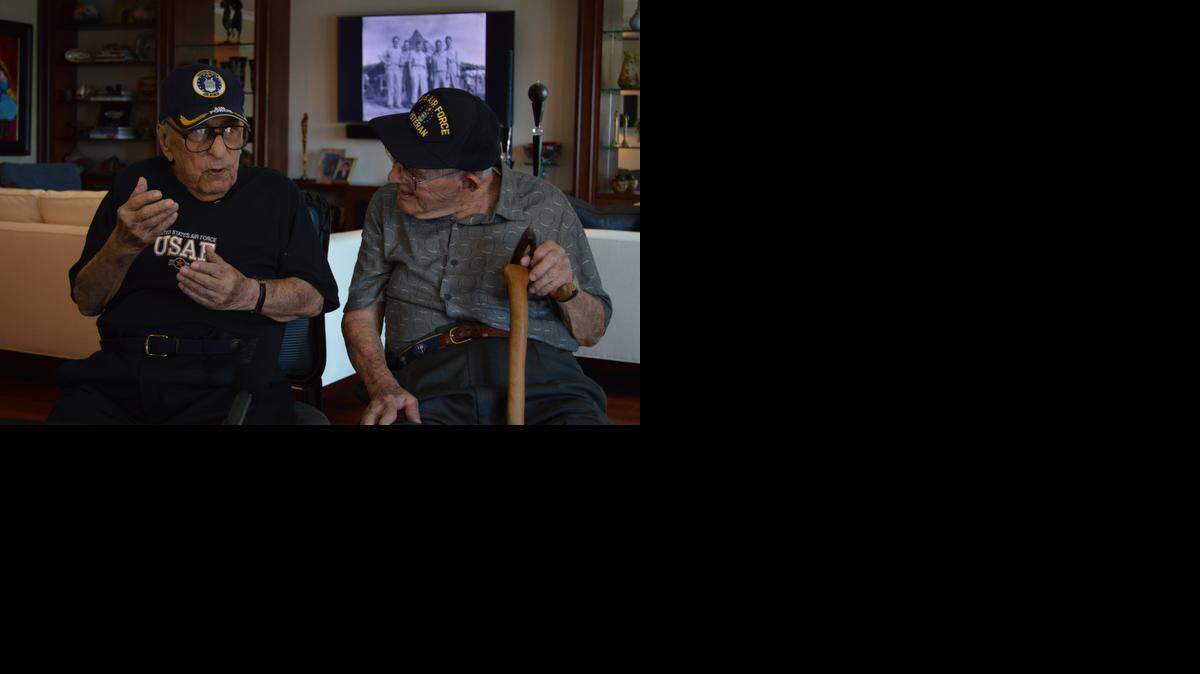 
Joseph Beale, right, listens as Max Massey recalls the war they endured together.
