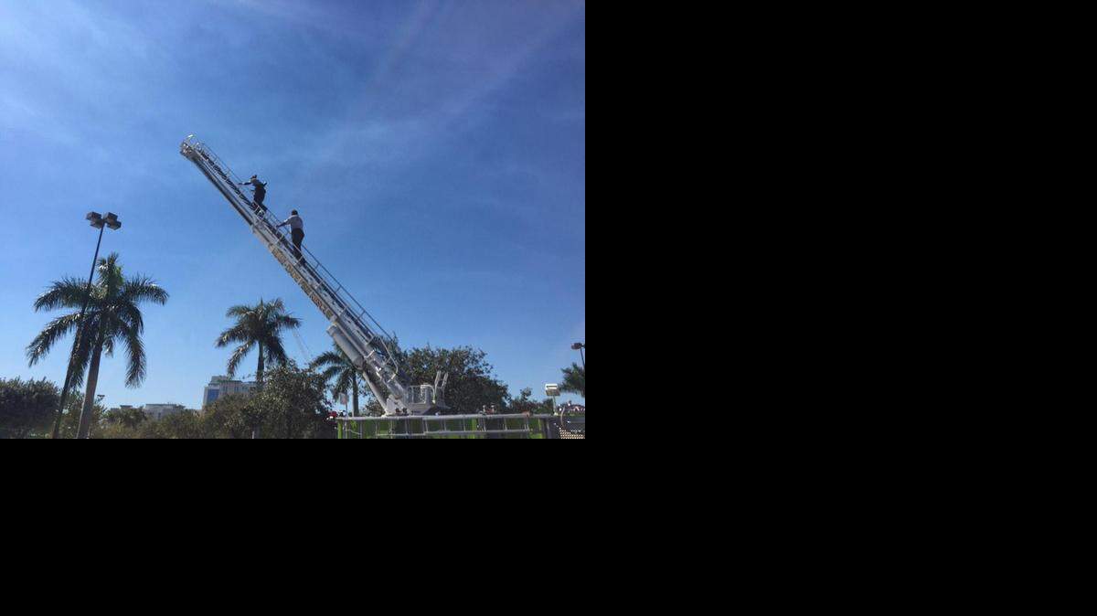 
Firefighters take aerial pics of crime scene near Target in Aventura after a shoplifter took off and cops shot at the car.
