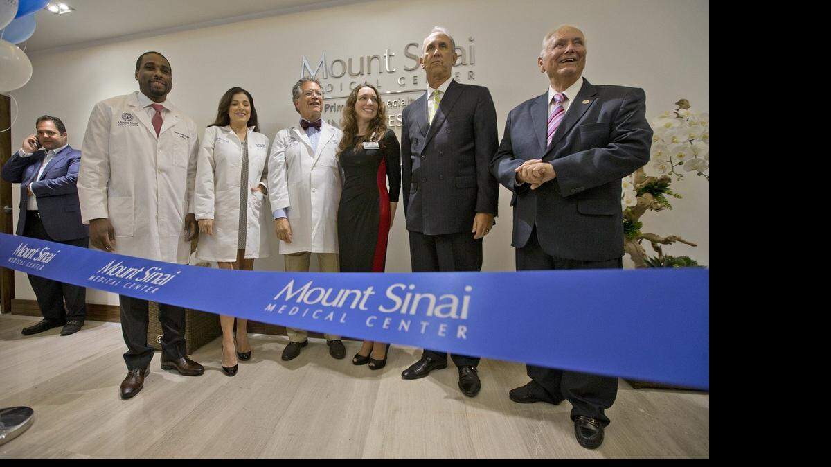 
From left, Bernard Ashby, M.D., Sylvia Diaz, M.D., Gervasio Lamas, M.D., Yuliya Korinenko, M.D., Mount Sinai Medical Center President and CEO Steven Sonenreich and former Sunny Isles Beach Mayor Norman Edelcup attend a ribbon-cutting event for the opening of the Mount Sinai Sunny Isles Beach Primary and Specialty Care Center on Wednesday April 22, 2015.

