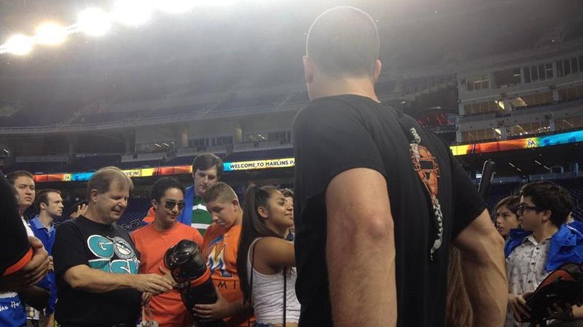 
Marlins catcher J.T. Realmuto describes the equipment to Lighthouse students. 
