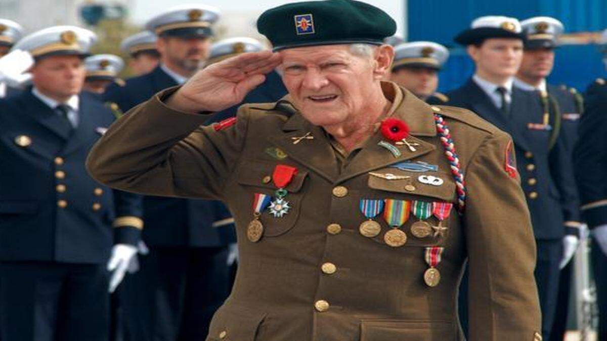 
World War II veteran Frederick Conrod salutes during the French national anthem. Conrod, 92, received a Legion of Honor medal aboard the French vessel, The Monge, on Friday.
