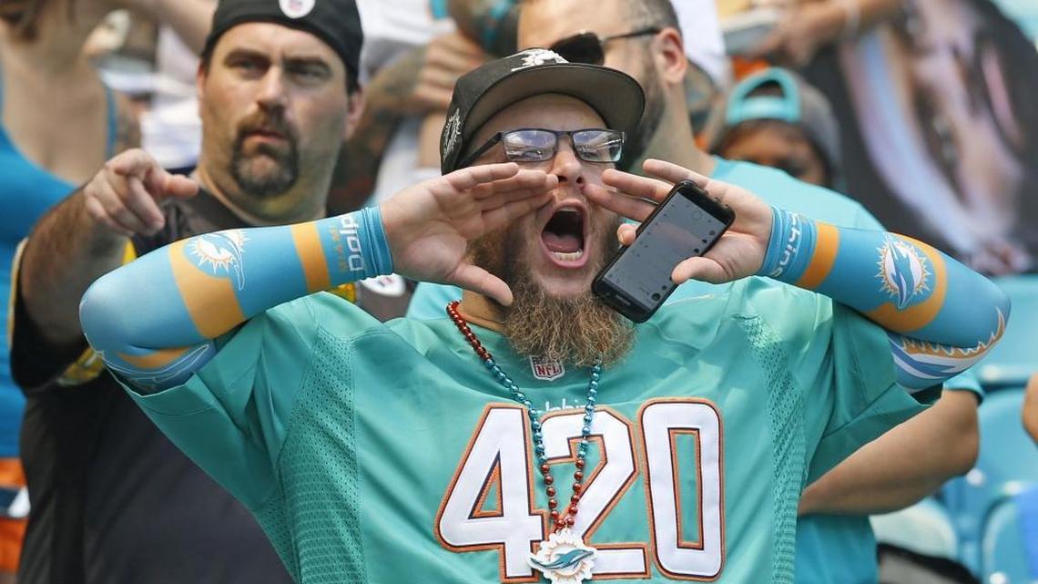 A Dolphins fan shows his support with an appropriate number for April 20, World Cannabis Day.