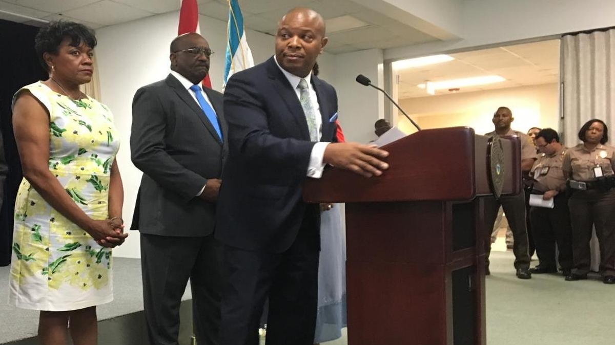 Morris Copeland, director of Miami-Dade’s Juvenile Services Department, at a March 30 press conference on steps the county is taking to address youth violence. Behind him are county commissioners Audrey Edmonson and Dennis Moss.