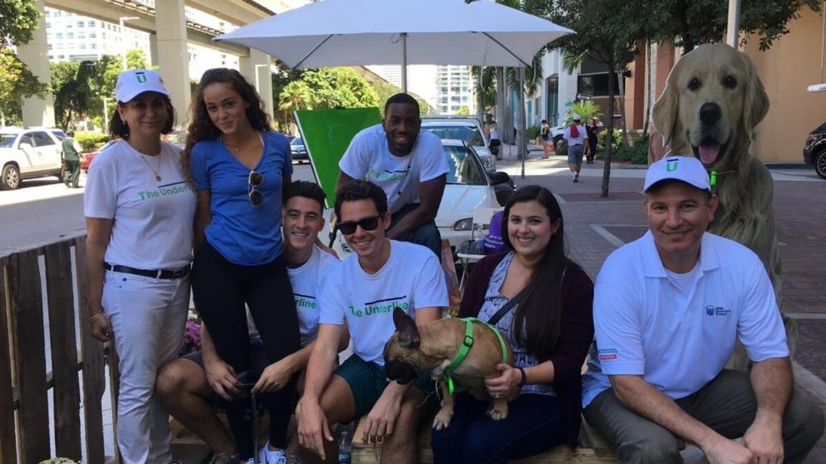 Gita Shamdasani, Carolina Fiol, Kevin Arrieta, Antonio Mcilwaine, Jean Paul Fiedler and a guest enjoy the pop-up dog café during PARK(ing) Day on Friday, Sept, 16, near downtown Miami.