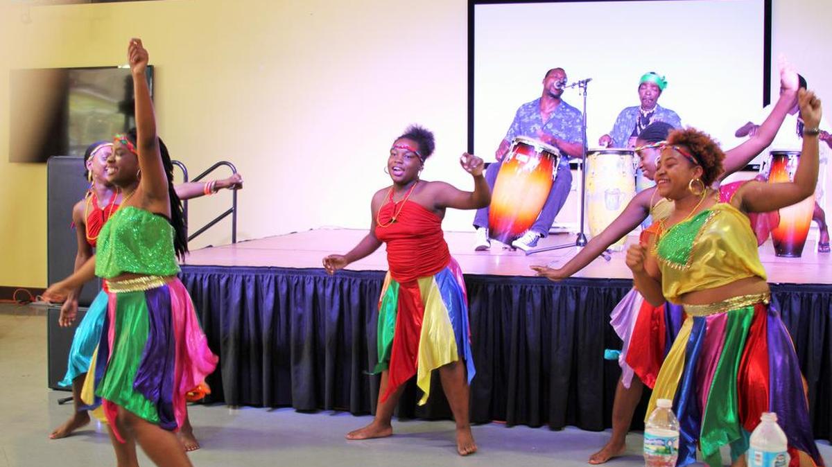 Members of the NSL Dance Ensemble entertain the audience during the Fourth Annual Haitian-Caribbean Book Fair, held at the Caribbean Marketplace at the Little Haiti Cultural Complex over the weekend.