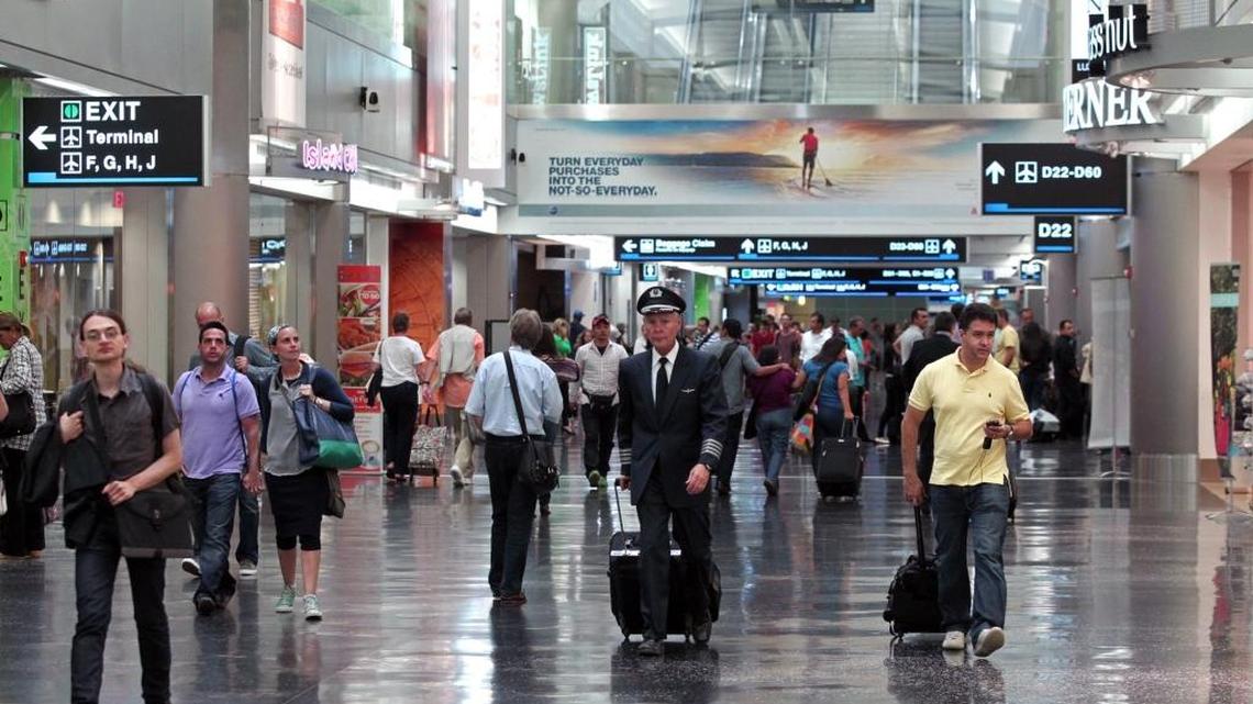 Passengers make their way to the gates at Miami International Airport, a bustle patrons of a planned VIP terminal could  avoid. 