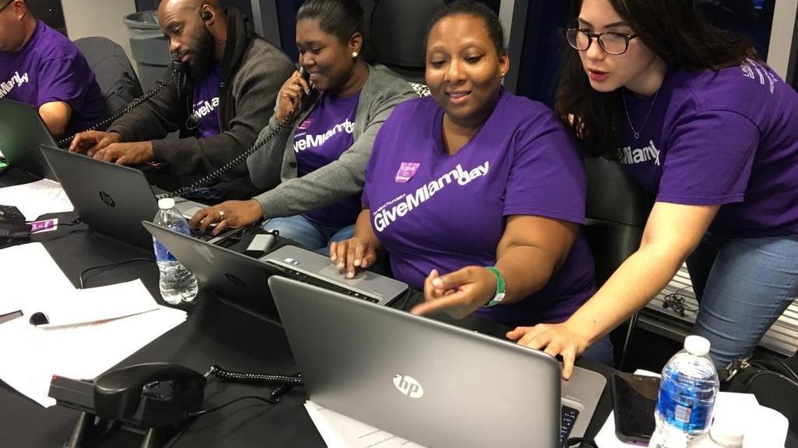 Volunteers at Give Miami Day headquarters at Marlins Park helped the Miami Foundation raise a record $10.1 million in 24 hours on Thursday, Nov. 16, 2017. From right are Keria Rebustillo, Kamilah Wallen, Staycie Gabelus and Justin Harris of The Miami Foundation.