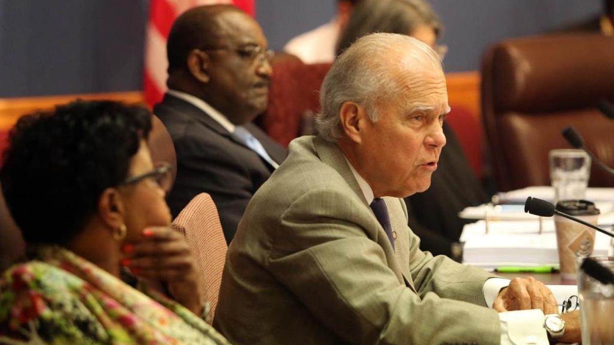 Miami-Dade Commissioner Javier Souto, leaning forward to speak during a commission meeting, is facing criticism for celebrating “our King, Jesus” in an official letter to constituents wishing them a Merry Christmas.