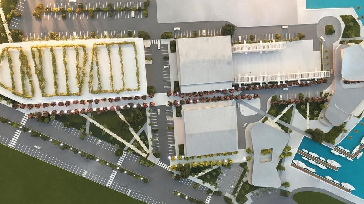 
A 3D model showing the new parking garage (right) next to two renovated hangars and three restaurants on the water (left).
