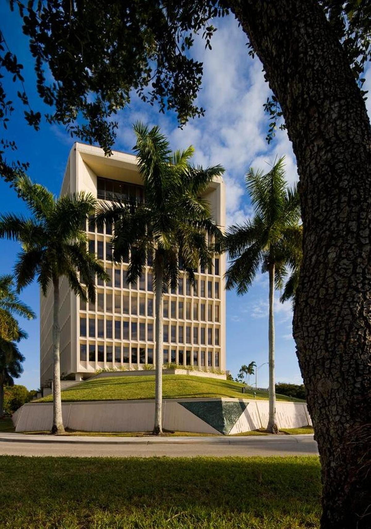 The exterior of Office in the Grove, designed by architect Kenneth Treister, with a prow-like wall that’s embellished at the corner with a bas relief of a banyan tree.