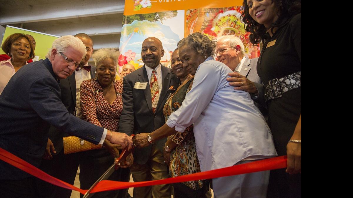 
From left: Greater Miami Convention & Visitors Bureau President William D. Talbert III, Miami District 5 Commissioner Keon Hardemon, GMCVB Multicultural Tourism Committee chairwoman Carole Ann Taylor, Collaborative Development Corporation (CDC) President Jihad S. Rashid, CDC Board Member Brenda Rivers, civil rights leader Thelma Gibson, Miami Mayor Tomas Regalado, and GMCVB VP of Multicultural Tourism and Development Connie Kinnard cut a ceremonial ribbon to officially open the new Coconut Grove Village West Visitor Center in the KROMA Gallery on Grand Avenue on Monday, July 20, 2015.
