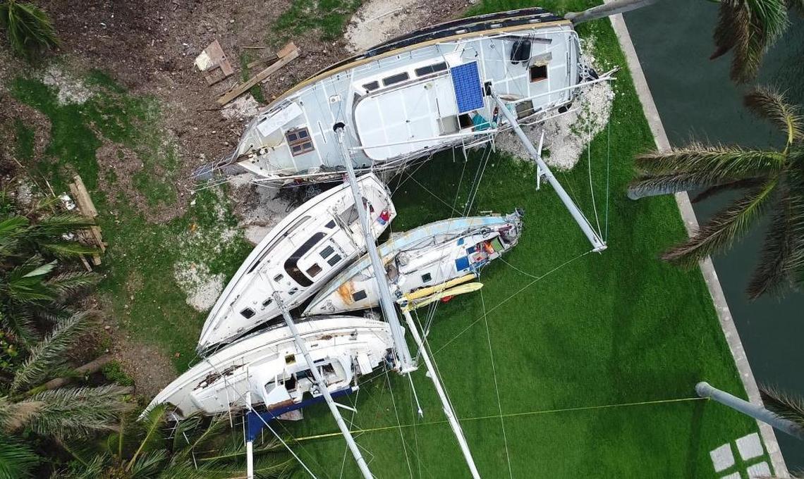 Four sailboats litter the lawn of a mansion in Coconut Grove. The boats were left stranded after strong winds and storm surge from Hurricane Irma pushed them ashore in 2017.