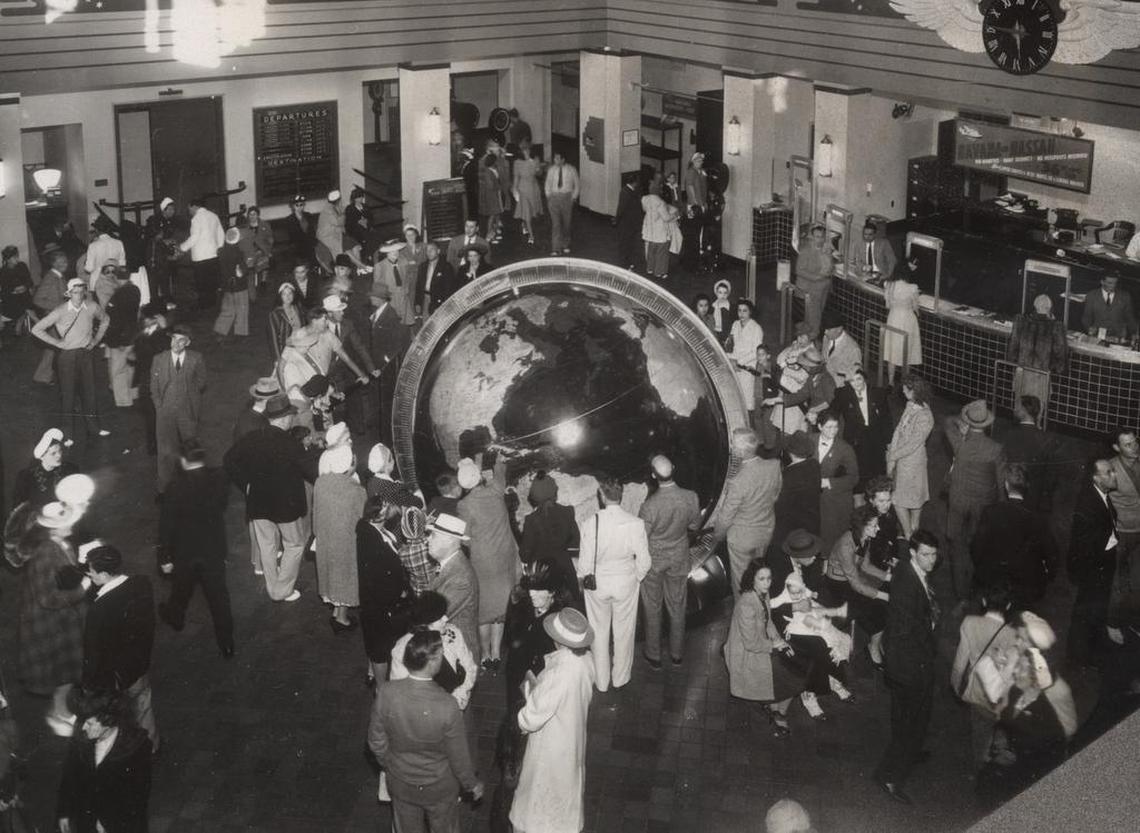 The interior of the Pan Am terminal, now Miami’s City Hall, as it was in the mid-1930s. Crowds gathered to watch the planes, greet travelers and marvel at the globe, made by Rand McNally.