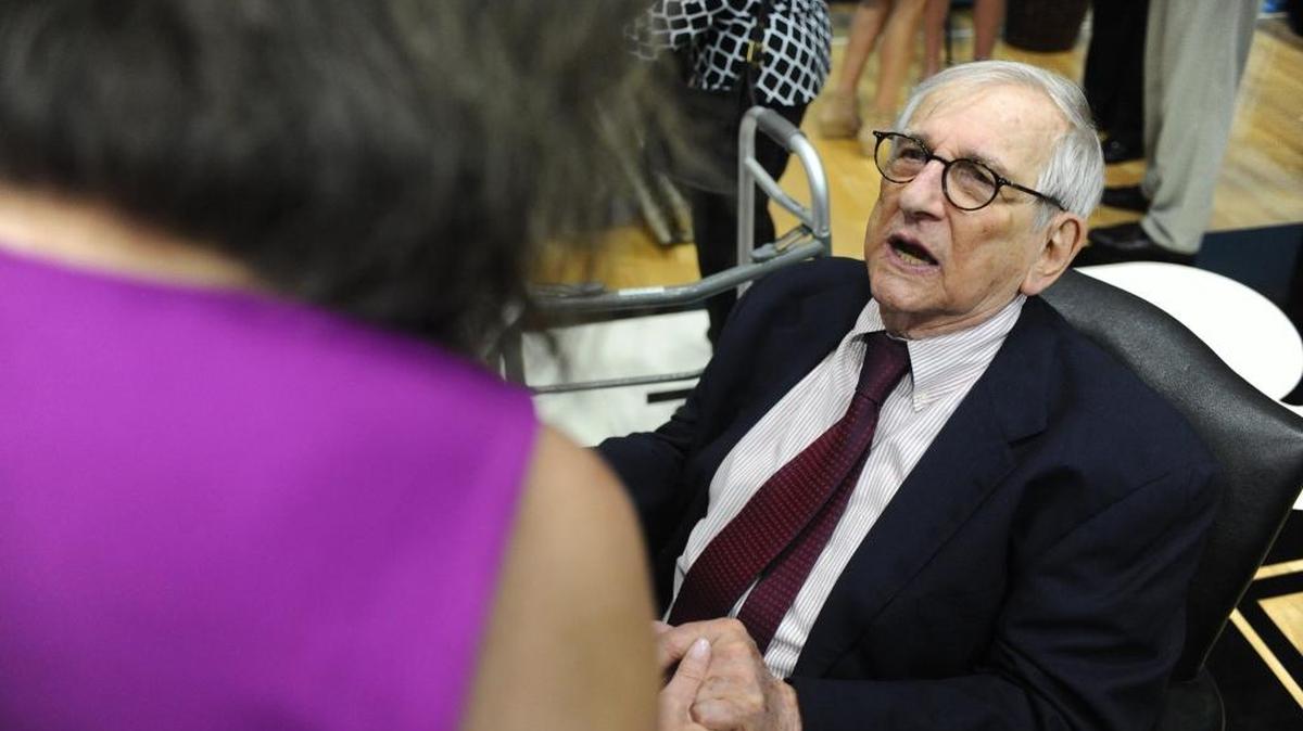 Dan Bowden, an English teacher who has taught or advised at Ransom Everglades School in Coconut Grove for 60 years, speaks to his former student Rosanne Model on June 4, 2016. More than 400 former students, friends and fellow teachers honored Bowden for his 60 years at the school and celebrated his 87th birthday.