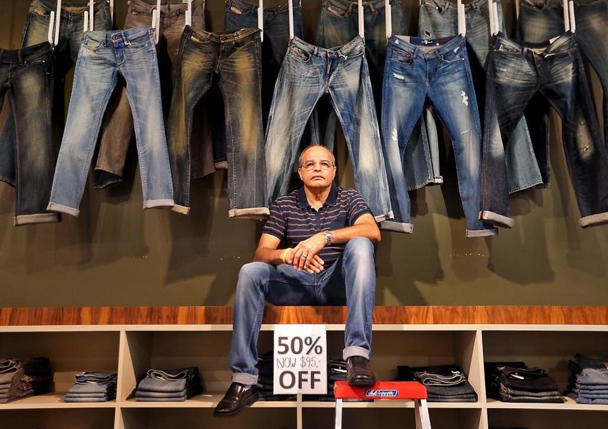 Zahir "Rani" Merali at his clothing boutique Rani's in Coconut Grove on Thursday, July 20, 2017. Rani's is closing after 46 years of business. The store is being pushed out due to increased rent, and is closing at the end of the month.