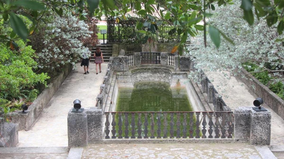 Robert Jarden, 23, left, and Yaisa Batista, 27, walk through the Marine Garden Wednesday at Vizcaya Museum and Gardens. This was the first day the garden has been opened in nearly 25 years.