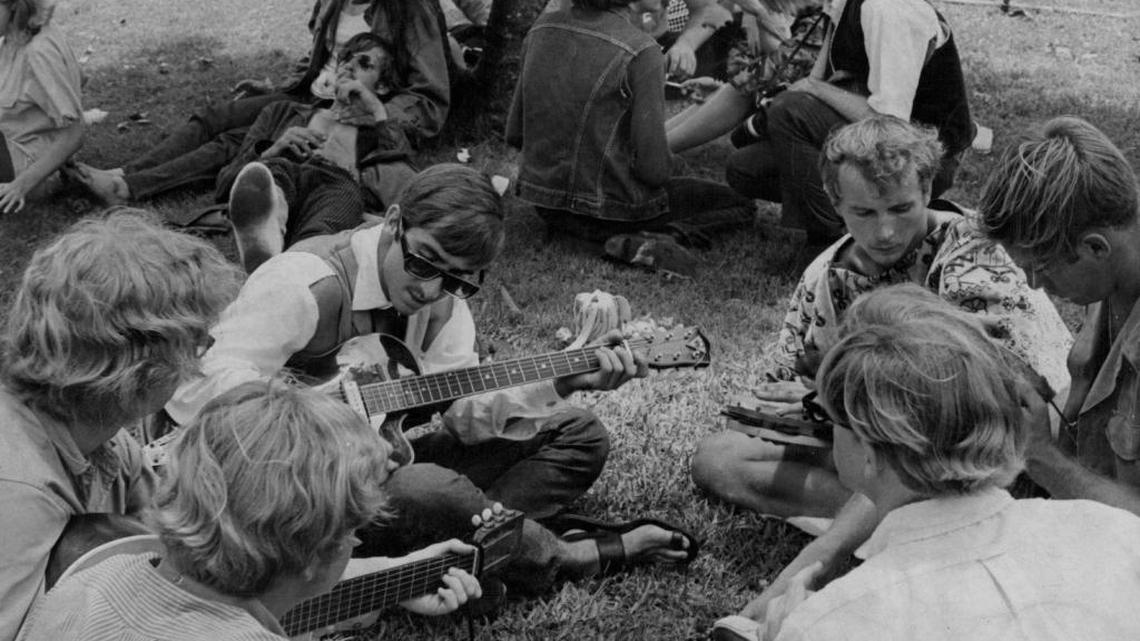 Hippies playing guitar on June 18, 1967.