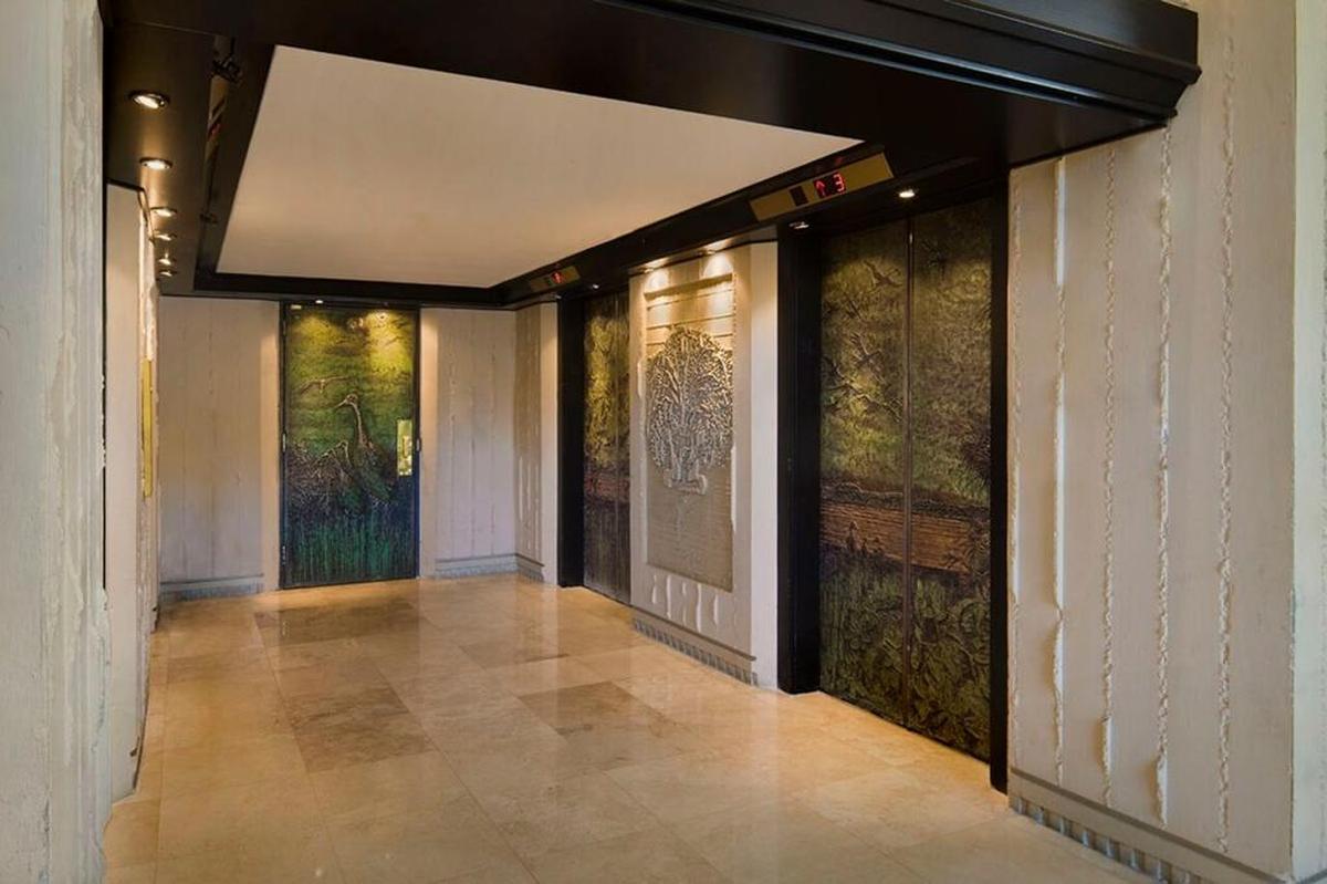 The richly decorated elevator lobby in Office in the Grove, designed by architect Kenneth Treister, before it was stripped of ornamentation by new owners.