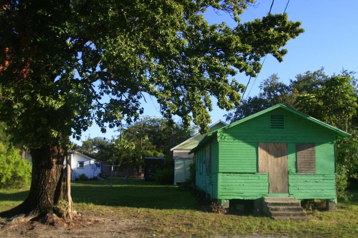 A boarded-up “shotgun” house in west Coconut Grove in 2012.