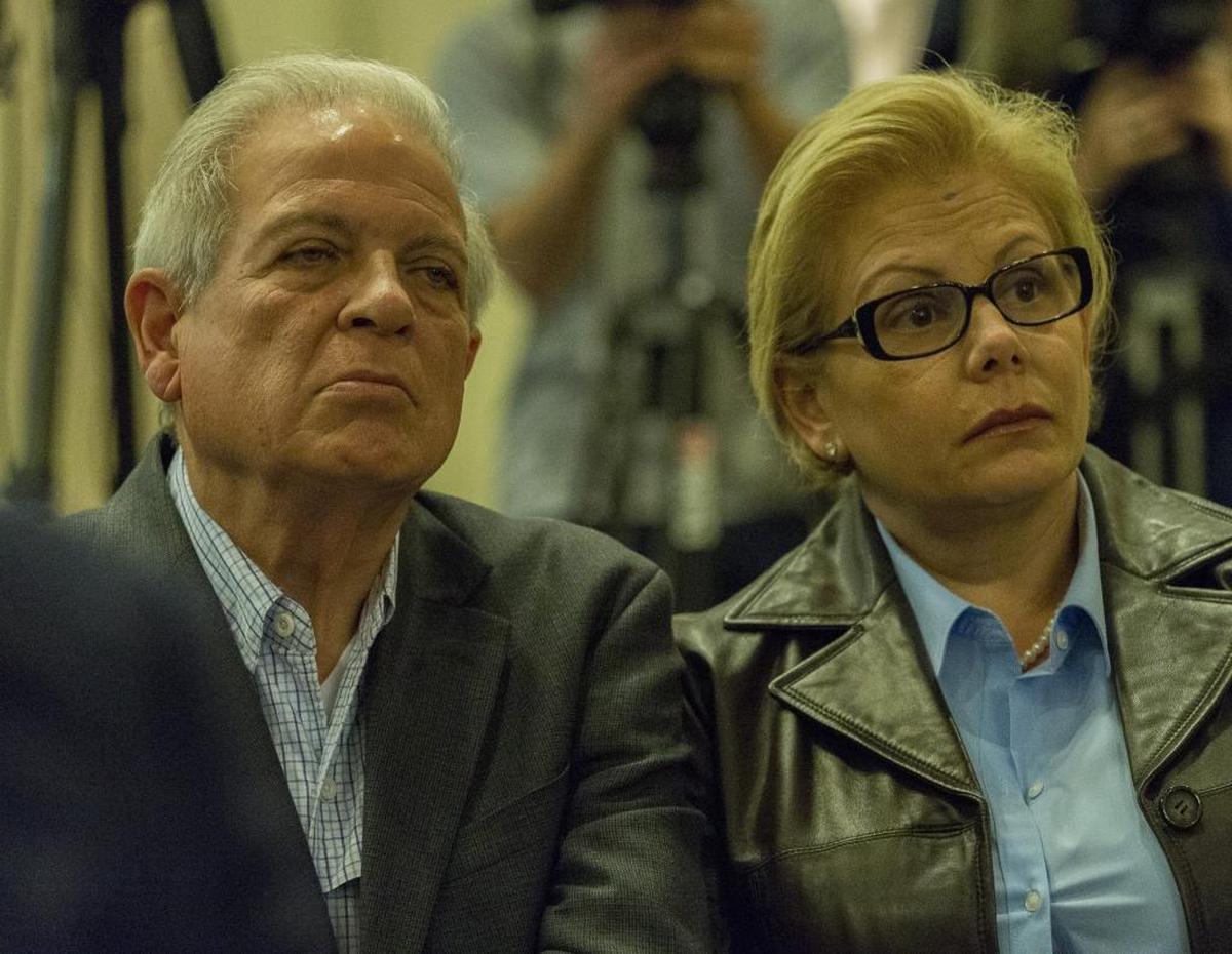 City of Miami Mayor Tomas Regalado and wife Ana Cristina Carrodeguas listens to Marco Rubio during a fundraising campaign at the Intercontinental hotel in downtown Miami on Jan. 10, 2016.