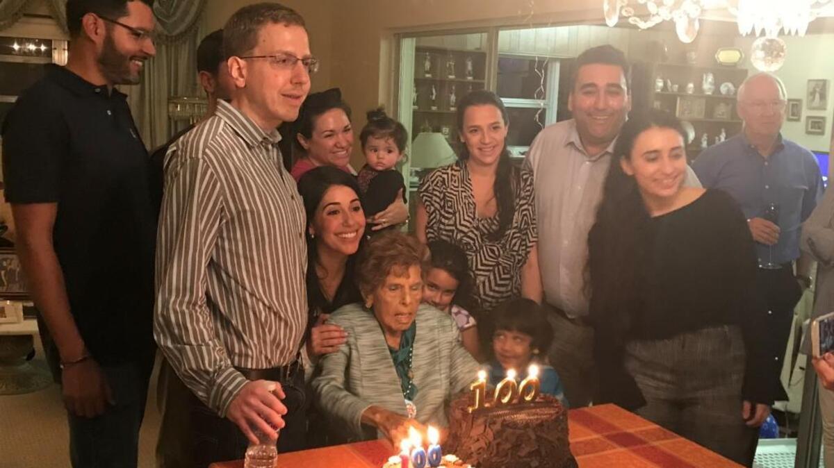Josephine Korge, 100, surrounded by her grandchildren and great-grandchildren.