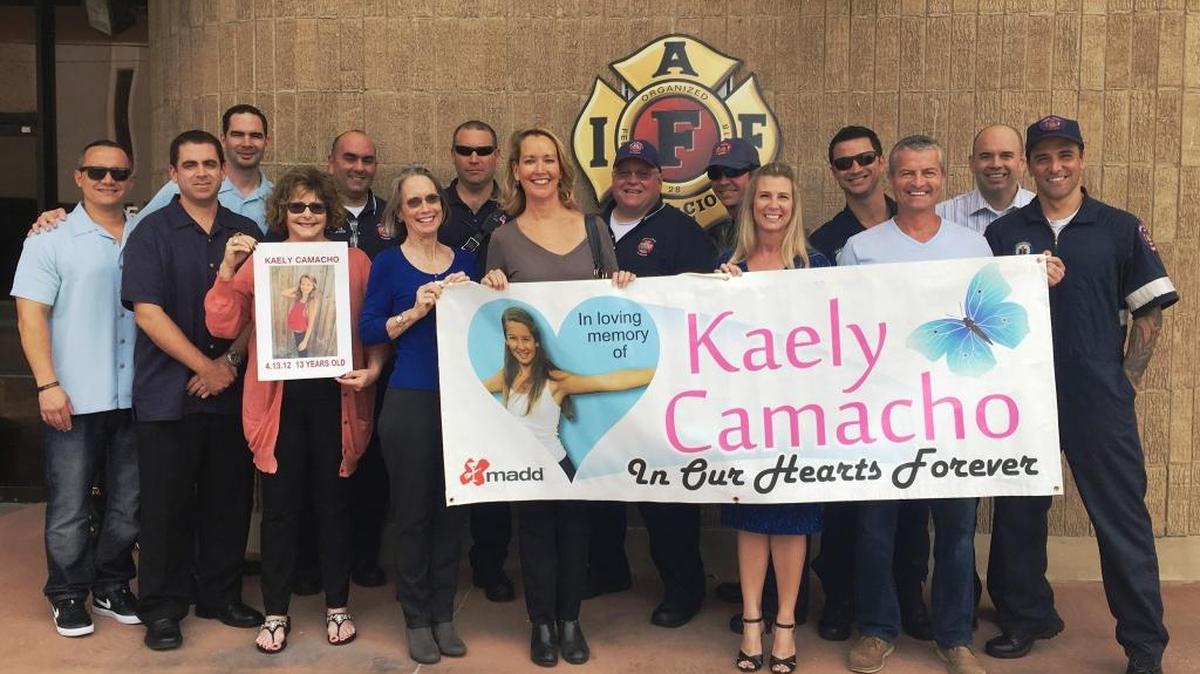 Accepting the South Florida Council of Fire Fighters donation are representatives of Mothers Against Drunk Driving (MADD) Angie Camacho and Coral Gables Firefighter Tim Mungovan. A drunk driver killed Camacho’s daughter, Kaely, in 2012.
