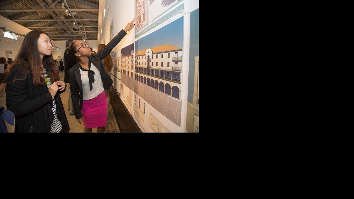 
University of Miami Architecture students Chloe Pereira and Xinyu He look over features of their redesigned Hialeah industrial site.
