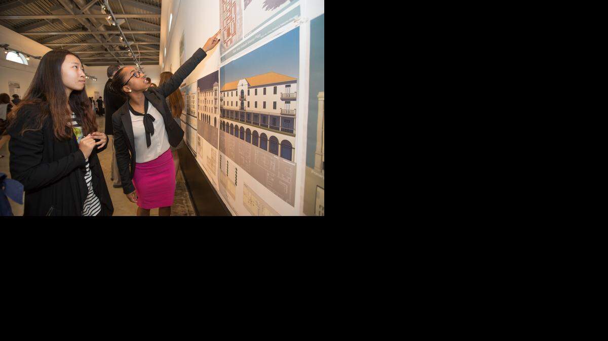 
University of Miami Architecture students Chloe Pereira and Xinyu He look over features of their redesigned Hialeah industrial site.
