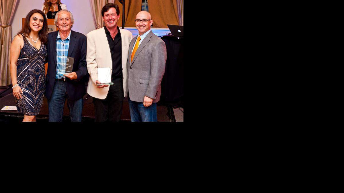 
Celebrating at the first Junior Orange Bowl Gala are from left, Executive Director Jessica Cerda-Antomarchi; Charles DeLucca, Jr. and Charles DeLucca, III of First Tee of Miami; and Peter Tolmach. The Junior Orange Bowl recently honored the following for their commitment to helping children: Dr. Narendra Kini, CEO of Miami Children’s Hospital; William H. Kerdyk, vice mayor of Coral Gables; and Charles DeLucca, Jr. and Charles DeLucca, III, of The First Tee of Miami.
