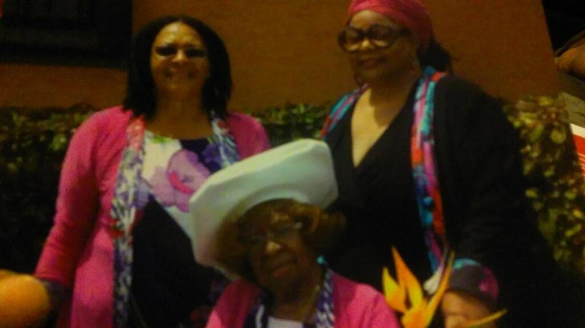 Former Liberty Square Housing Project residents Valeria Jackman and Jackie Rawls with their 95-year-old mother, Bertha Glover.