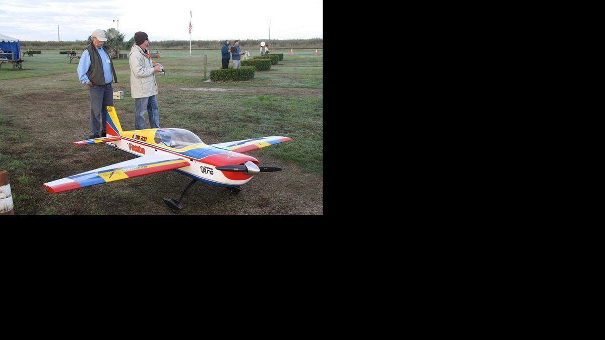 
Jeffery Johnson, left, and pilot Jim Woodward participated in the 2014 Aero Modelers of Perrine (AMPS) Aerobatics Challenge featuring giant-scale model planes. 

