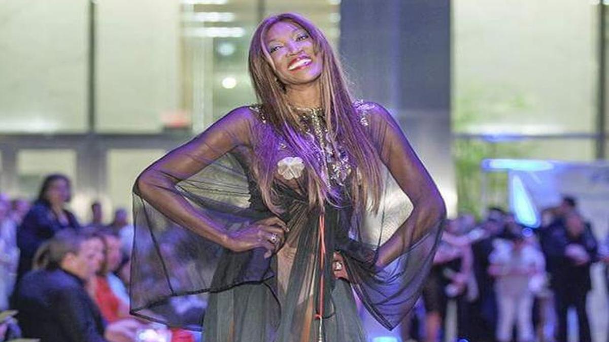 Mayra Joli, owner of Mayra Joli Immigration Law, shows off a designer ensemble at the third annual Fashion Night on Brickell to benefit Dade Legal Aid.