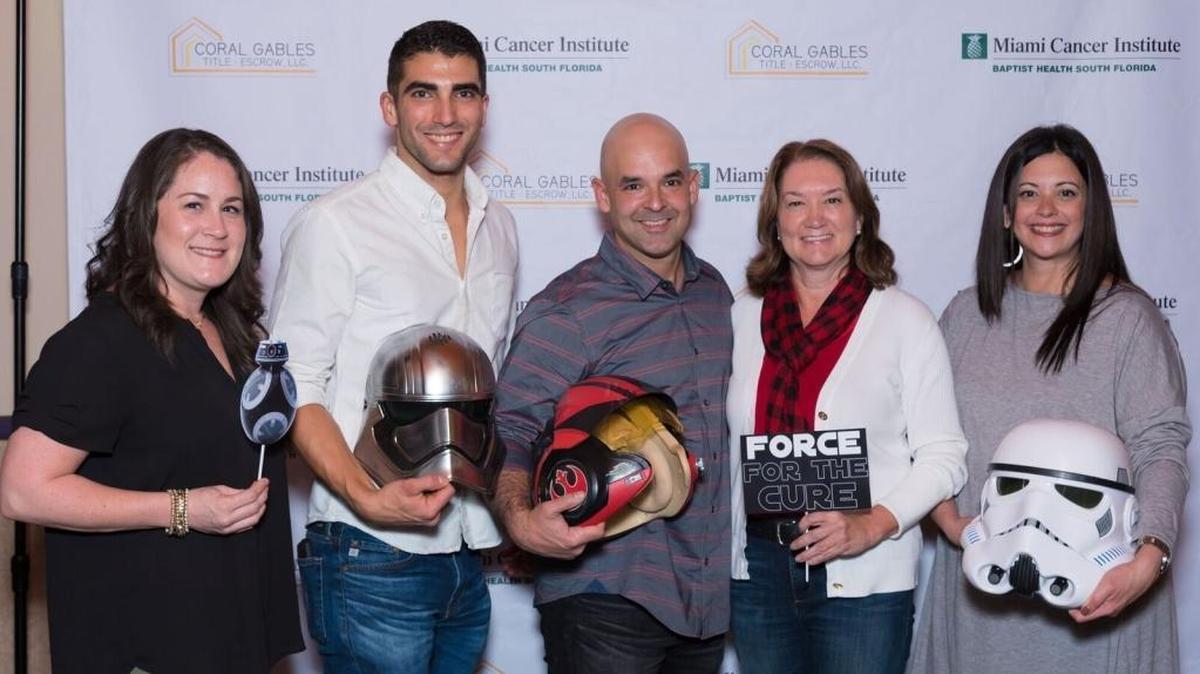 Raising funds for Miami Cancer Institute at a private premiere screening of “Star Wars: The Last Jedi” are, from left, Brandi Syatauw Heddings, Baptist Health South Florida director of development; Brad Barreto, Coral Gables Title + Escrow chief financial officer; Richard Barbara, Coral Gables Title + Escrow chief operations officer; Jamie Thomas, Baptist Health South Florida assistant vice president; and Annie Martinez-Lopez, Baptist Health South Florida assistant vice president.
