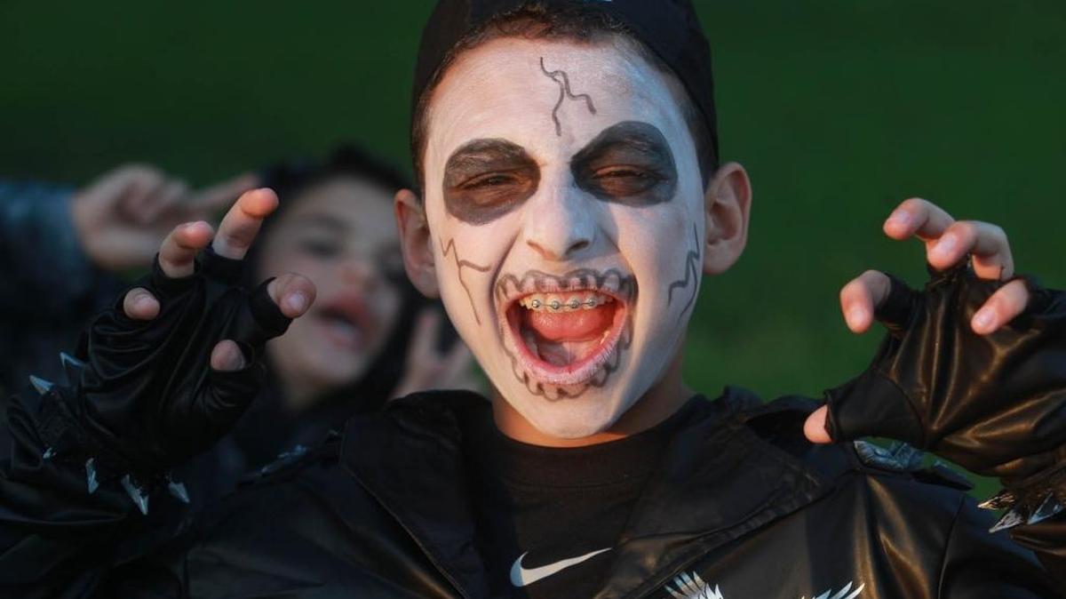 A child trick-or-treats in Southwest Miami-Dade on Halloween in 2014.