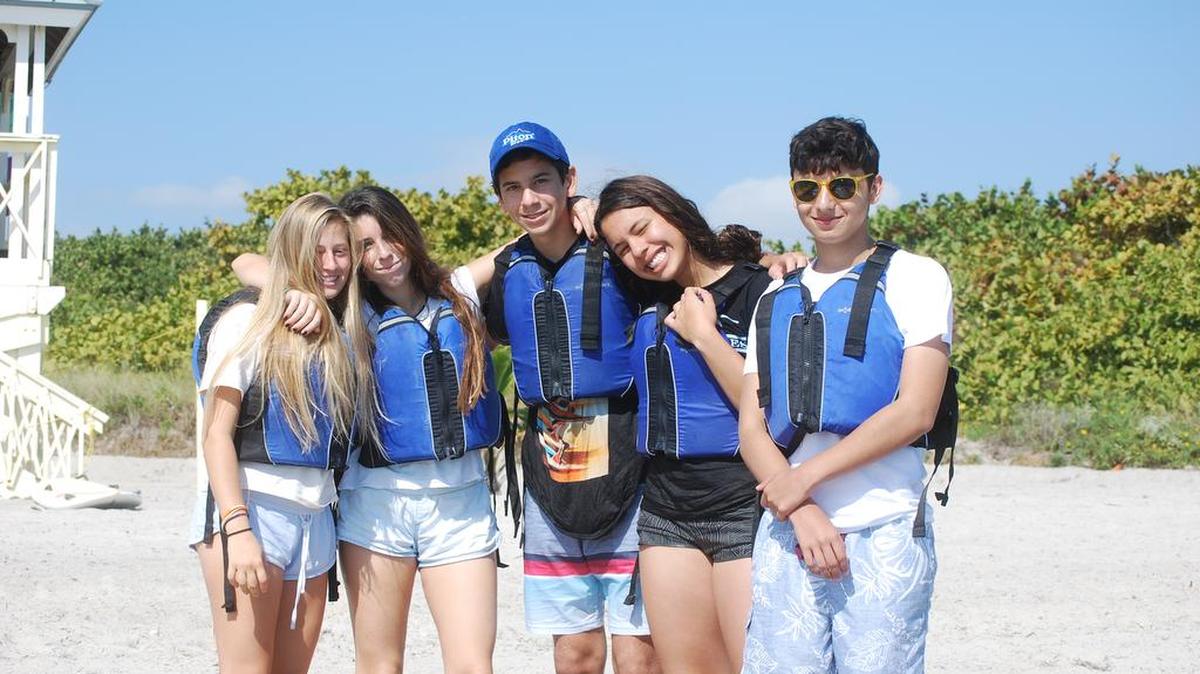 EarthKeepers Club President Daelyn Einhorn and members Cala Roitberg, Tomas Esber, Alice Cohen and Carlos Sanchez enjoy Biscayne Bay while they help protect its environment.