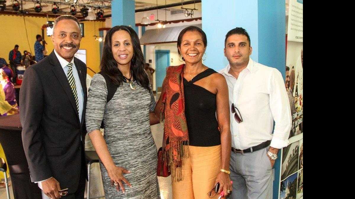 
Carlos Tait, director of sales for the Greater Miami Convention and Visitors Bureau; Connie Kinnard , the GMCVB’s vice president for multicultural tourism; and representatives of the eastern Caribbean & Jamaica at the Caribbean Heritage Showcase Welcome Reception June 16, 2015, at the Little Haiti Caribbean Marketplace. 
