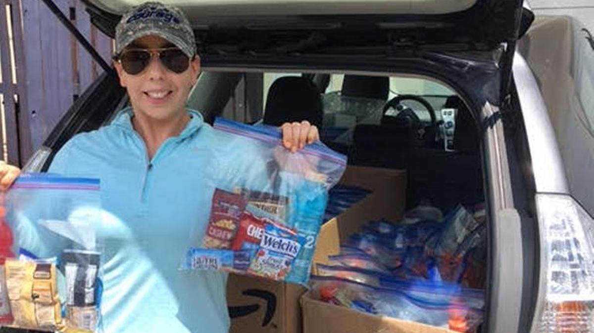 Melissa Sullivan spent her September birthday month doing volunteer service, for the third year in a row. Here she is with supplies donated for the difficult times after Hurricane Irma in the Florida Keys.