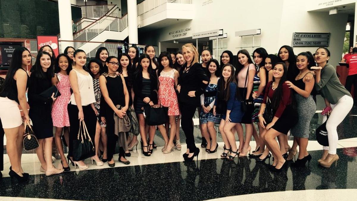 Hammocks Middle School dance teacher Wendy Lee Schwartz, who will soon retire, and her students strike poses at their recent visit to see the Alvin Ailey American Dance Theater performance.