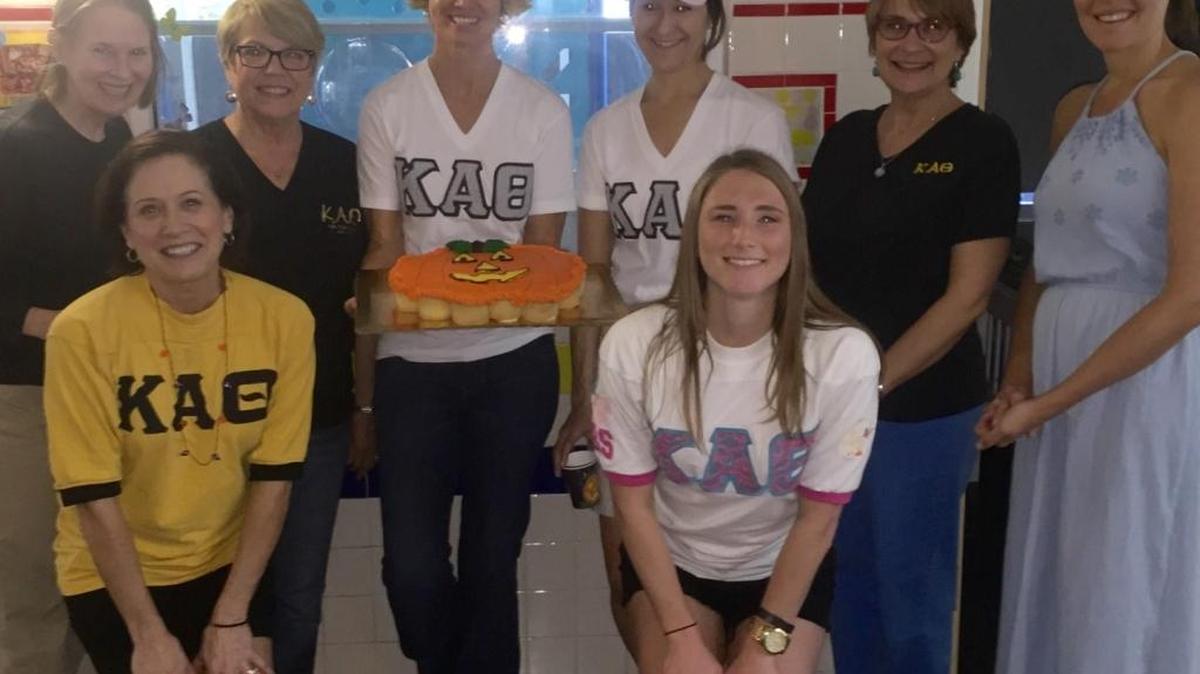 Hosting a party at the Childrens' Home Society McLamore Center are from left: Carrie Cleland, Kappa Alpha Theta's Miami Alumnae Chapter president Kirstie Bray, Linda Clark, Kit Wills, Lisette Betancourt, Lisa Rennison, Andrea Mustelier, and Lisa Koch.